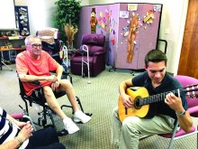 A client of the Perfect Place enjoys listening to Daniel Tekunoff play.