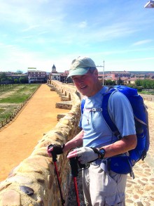 Brian Hill on a 13th century medieval bridge while hiking the Camino de Santiago in Spain.