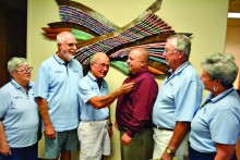 Sun Lakes Fire District’s fire board members pin the Chief’s badge on the new SLFD fire Chief Troy Maloney at a board meeting where he was introduced to the community. Pictured left to right are fire board members Bernadette Halpin, John Crawford and Chairman Michael Sellers, Chief Maloney and fire board members Forrest Kohler and Diane Price.