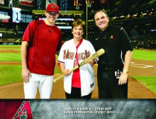 Sarah Pennington is flanked by D-backs pitcher Patrick Corbin (left) and President Derrick Hall (right) as she is honored at Chase Field.