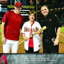 Sarah Pennington is flanked by D-backs pitcher Patrick Corbin (left) and President Derrick Hall (right) as she is honored at Chase Field.