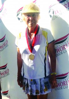 Bev Shalin shows us her gold medal for 80 Plus Women’s Doubles at the Huntsman World Senior Games.