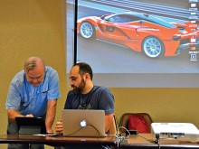 Bryan Beata, President of the Apple Users Group, and Kenneth Nelson discuss a new iPad feature at last month’s meeting.