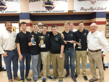 Pictured (left to right) volunteers Derek Logan, Bill Klein, SAE Event Coordinator Ken Francis and volunteer Don Robins, with the winning team (in black shirts).