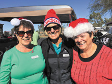 Celebrating the season on December 17 were golfers (from left) Betty Ennis, Lorrie Morgan and Diana DePree of the Cottonwood Lady Niners.
