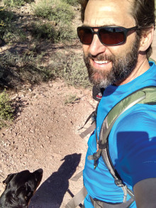 Greg Miller, owner of EZ Roll Out Shelves, and his dog, Dixie, out for a hike.