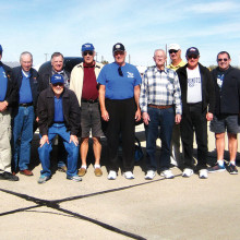 Fourteen Sun Lakes Aero Club members made the trip to Pima Airport for lunch January 22; left to right standing are Steve Perkins, Gary West, Jim Theobald, Dick Simmons, Paul Beek, Cannon Hill, Bob DeLong, Craig Day, Tom Howard, Chris Beauchamp, Gene Evans, John Philp and Ken Carpenter; kneeling is Gary Vacin.