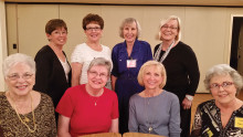 Fashion show models: front row Esther, Debbie, Jan and Sandy; back row Winnie, Joyce, Rita and Ursula