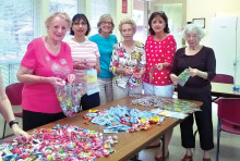 The group getting ready to bag candy for Easter baskets.