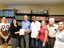 Pictured (left to right) Kenny Ngunyen (Arizona State University Rotaract member), Trinity Donovan (C.E.O. of the Center), Tom Adamson (incoming club president), Dan Albertson (club president), Susanne Kaufman, Art Brown and Karen LeSage.