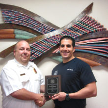 Sun Lakes Fire District Chief Troy Maloney (left) congratulates Captain Mike Molite on his 10th anniversary with SLFD. Molite holds an associate degree in fire science from Maricopa Community College and is an emergency medical technician. An acting engineer for seven years, he is an officer with his union SLERF (Sun Lakes emergency relief fund) and was promoted to captain in 2014. Prior to joining SLFD he worked in the emergency room at Chandler Regional Hospital. (Photo by LouAnn Sedgwick; caption by Brian Curry).