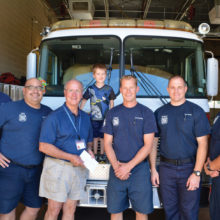 The SLFD crew pictured (left to right) Firefighter/Paramedic Tom Geffert, Paramedic Jaime Gonzales, Jerry Rex and his grandson Brendan, Engineer/Paramedic David DeGraaf, Firefighter/EMT Tyler Quier and Captain/EMT Ron Puchta.