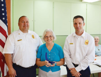 Sun Lakes Fire District Chief Troy Maloney (left) and Deputy Chief Rob Helie (right) presented a token of appreciation plaque to the Sun Lakes Women’s Association for their many years of support. Accepting the award for the association was President Collette McNally. Maloney thanked the women for their “unwavering generosity and philanthropy with the Fire District and the Sun Lakes community.” McNally commented that the SLWA was founded to help support the beginnings of what was then the Sun Lakes Fire Department when it was manned by all volunteers. (Photo and caption by Brian Curry),