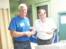 Tom Waldron described his experiences as a rescue helicopter pilot during the Vietnam Conflict during a presentation to the Sun Lakes Aero Club April 18. Here he is shown with Cannon Hill, SLAC President (left); photo by Gary Vacin.