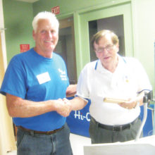 Tom Waldron described his experiences as a rescue helicopter pilot during the Vietnam Conflict during a presentation to the Sun Lakes Aero Club April 18. Here he is shown with Cannon Hill, SLAC President (left); photo by Gary Vacin.