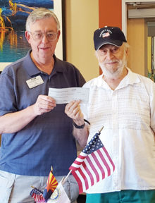On behalf of the San Tan Crown Rotary Club, Tom Adamson made a financial presentation to Art Sloane of Arizona Stand-Down.