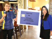 Joni Hiller, 2016 Swing for Hope Chair, presents ILGA’s check for $10,753 to the University of Arizona Foundation representative, Jeanette Gemoll.