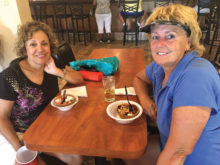 Curly Ferris and Debbi Ebel enjoying ice cream sundaes after league golf.