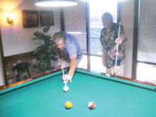 Lucky Shot Pool Club players Jerry Vickery (left) and Roy Partridge square off at the table.