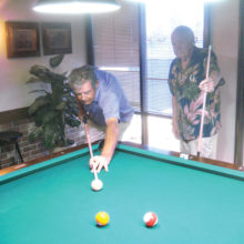 Lucky Shot Pool Club players Jerry Vickery (left) and Roy Partridge square off at the table.