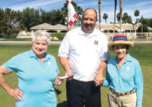Sharon Gale (left) and Margaret Johns present check to Hamilton High Girls’ Golf Coach Jeff Kain.