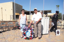 Participants Jay and Kathy Sanderson presenting the “Wreath of Remembrance.”
