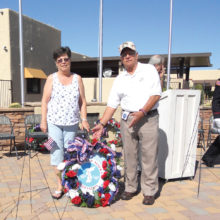 Participants Jay and Kathy Sanderson presenting the “Wreath of Remembrance.”