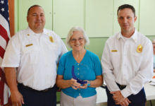 Sun Lakes Fire Department Chief Troy Maloney and Deputy Chief Robert Helie presented an award of gratitude to the Sun Lakes Women’s Association President Colette McNally at the May meeting.
