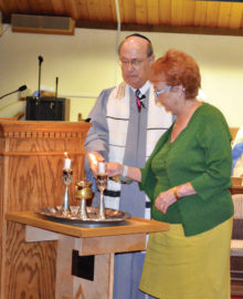 Candle lighting by Rabbi Wiener and Sandi Wiener