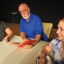 Raynelle (Andrea Hummel), Reverend Hooker (John Crawford) and Delightful (Joan Berger) attempt to come up with a suitable eulogy for Raynelle’s late husband, Bud.