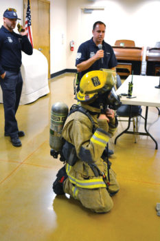 SLFD Captain Cory Evans explains what a firefighter wears inside a fire and how different they would look and sound in a time of an emergency.