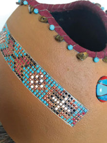 A close up of a beautiful collaborative piece created by two of our members. The mother–daughter team of Lee-Anne Heise and our Secretary Lynn Heise O-Malia created this gourd, referenced by a Native American war shirt. Just beautiful work!