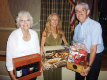 The door prize winners from left to right are Linda Boyd, Roberta Ferrazza and Dennis Evans.