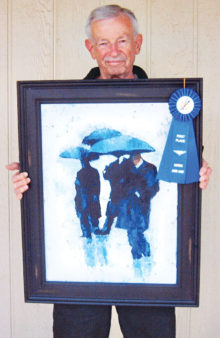 Bob Kwait with his award-winning painting, Rain