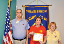 Pictured left to right are Arizona Lions Club District Governor Jim Whelan, new member Wendy Huffman and Rose Derocher, her sponsor