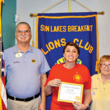 Pictured left to right are Arizona Lions Club District Governor Jim Whelan, new member Wendy Huffman and Rose Derocher, her sponsor