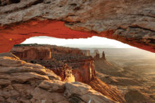 Photographers capturing Mesa Arch and Canyonlands N.P. by Burt Williams