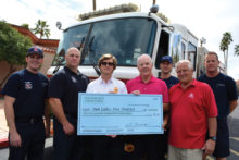 The crew of SLFD’s Engine 232 accepts a donation check from the Palo Verde Men’s Golf Association President Neil Curtis and the Co-Chair of the major events committee Gary Zahnow.