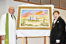 Rev. Marvin D. Arnpriester (left) displays new painting created by artist and church member Judy Yaryan (right) for Sun Lakes UMC fs 30th anniversary.