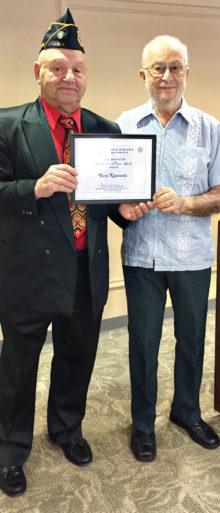 Gary Kanowsky receiving his award from Art Sloane, past Commander of the Post