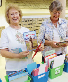 Diana McColly finds just the right card while Doris Brown looks at some of the beautiful cards available for sale.