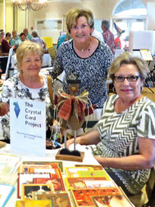 Diana Berry, Charlene Petragallo and Kathy Skrei display fall cards.