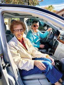 Volunteer Dot McNulty and client Betty Frank enjoy each other’s company as they run errands.