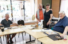 Longtime DAC members enjoying time together, painting and drawing