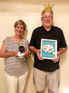 Pictured are Crowned King Neil Donohoe and Dog House Loser Jackie Morgan for the August 6 euchre party.