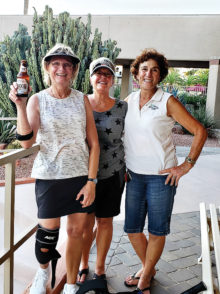 Judy Grefsheim, Kathy Malitar, and Nede Mead like the tennis food, and especially the beverages.