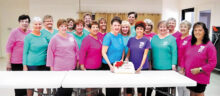 Members kick off this year with a cake to celebrate their upcoming 40th anniversary show.