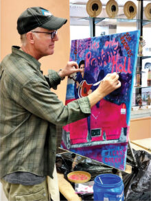 Member Howard Lundgren working on an acrylic painting