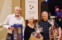 Door prize winners at the December Sun Lakes Dinner/Dance Party (left to right): Dave Cocco, Fran Stevenson, Peter Hanna
