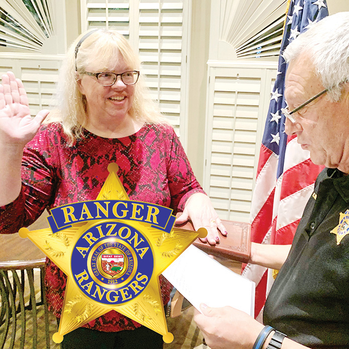 Victoria Romero recites the Arizona Ranger oath from Sun Lakes Captain Ron Burchett.
